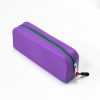 Orange silicone pencil case with purple zipper - Durable and waterproof stationery pouch for students and office use