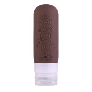 Refillable silicone travel bottle with embossed geometric pattern and leak-proof cap for toiletries and skincare liquids.
