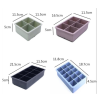Stackable silicone ice cube trays in multiple sizes and square grid patterns for home kitchen use.