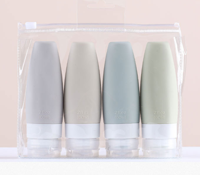 Designer silicone travel bottles with leaf-vein textured grip in four sizes for leak-proof skincare and cosmetic dispensing.