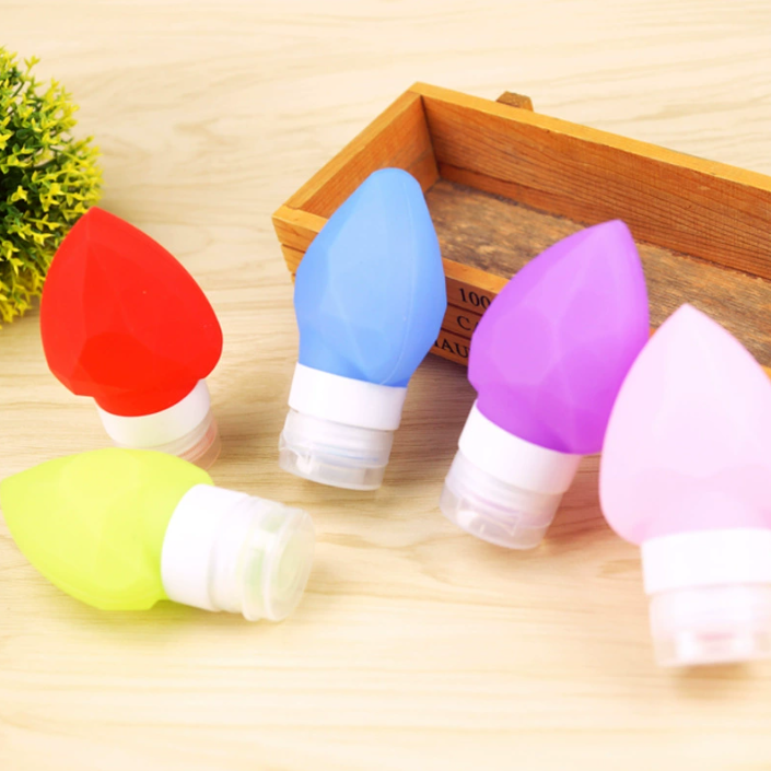 Bulb-shaped colorful silicone travel bottles for toiletries and lotions with a leak-proof squeeze design for easy packing.