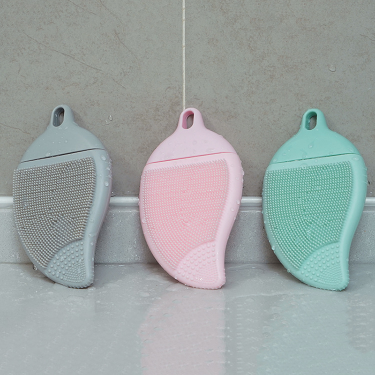 Leaf-shaped FDA food-grade silicone cleaning brush with soft bristles for gentle facial exfoliation and body massage.