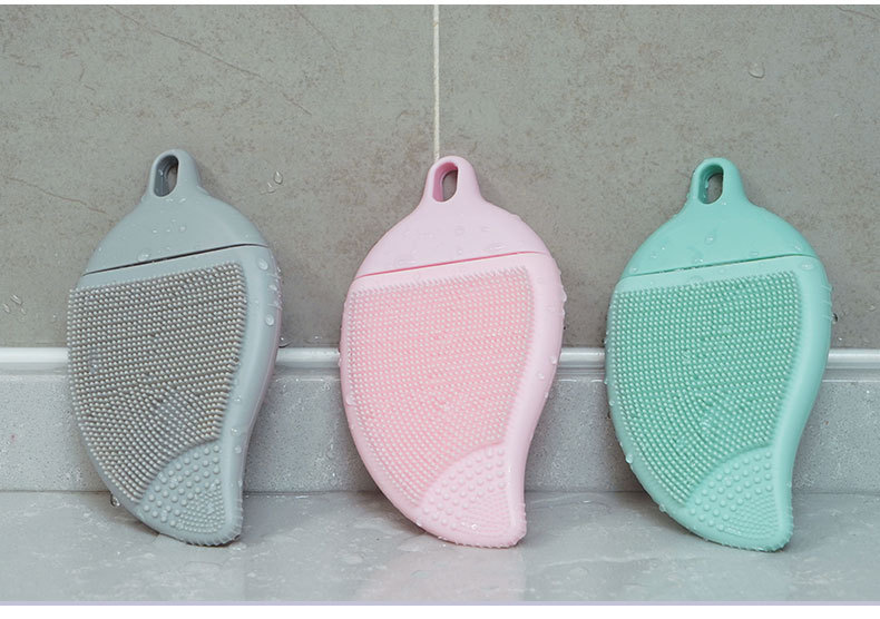 Leaf-shaped FDA food-grade silicone cleaning brush with soft bristles for gentle facial exfoliation and body massage.
