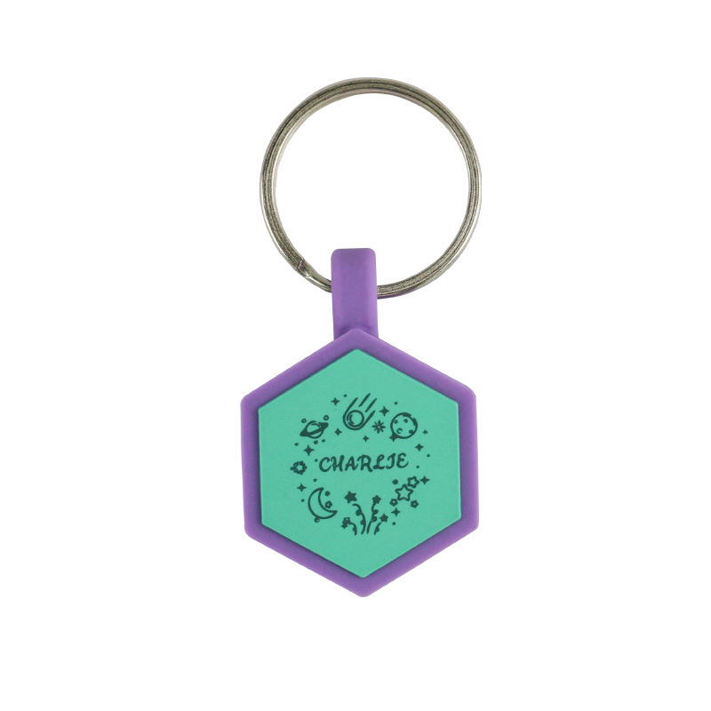 Customized pet ID tags in various geometric shapes like bone, triangle, and hexagon with engraved names for dog and cat safety.