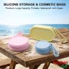 Portable silicone storage bags for makeup and cosmetics - Waterproof travel pouches on beach desk