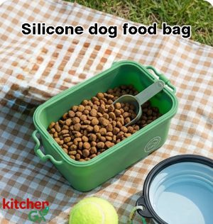 Blue silicone dog treat pouch hanging on hiking backpack with golden retriever puppy in background