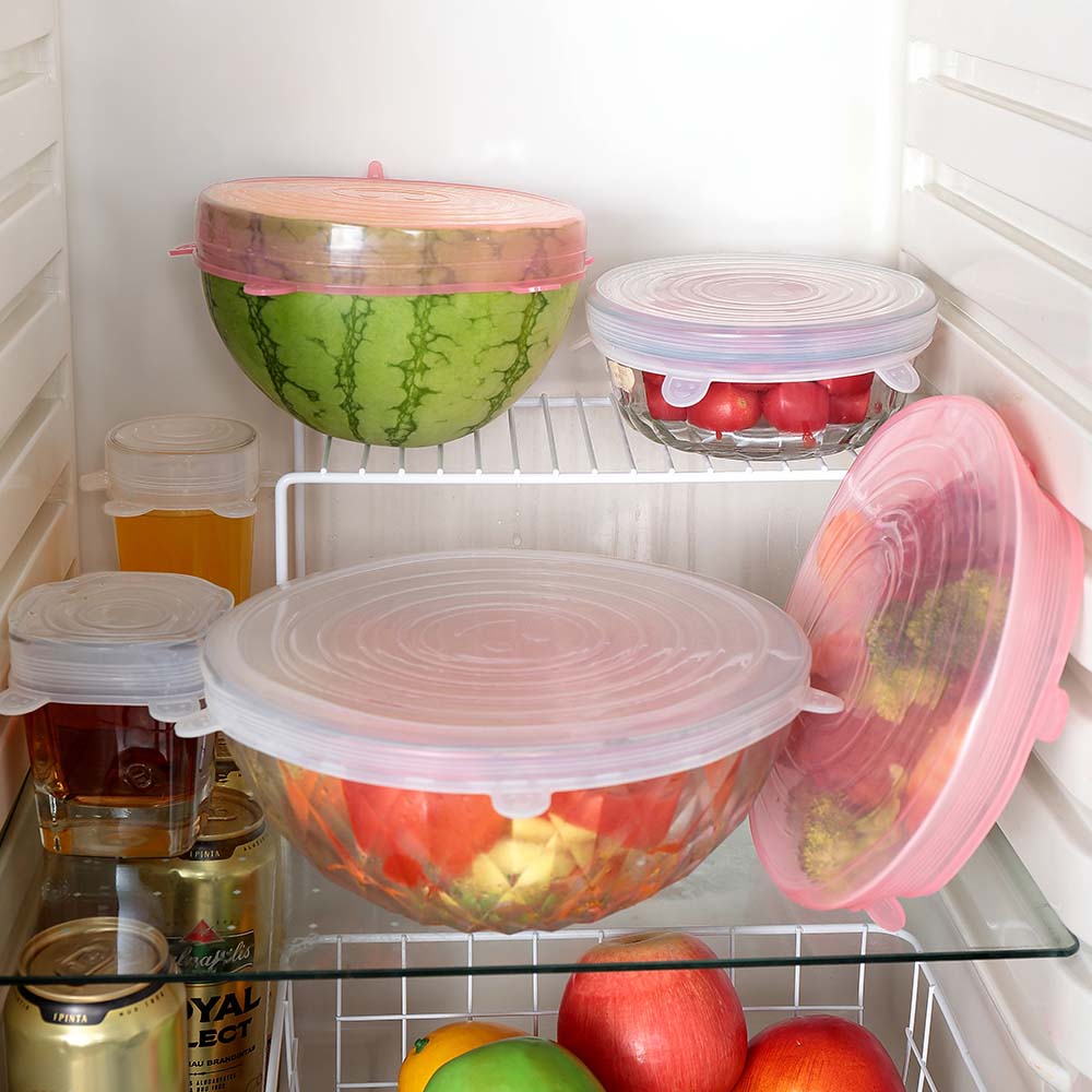 Silicone food cover stretching over a container