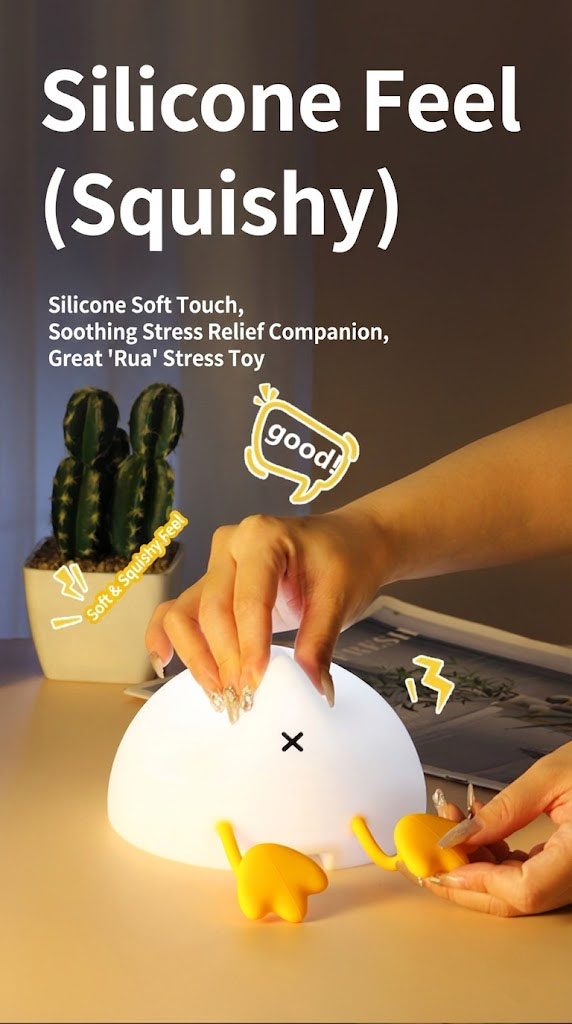 Hand squeezing the soft silicone duck lamp to demonstrate its squishy and stress-relieving texture.